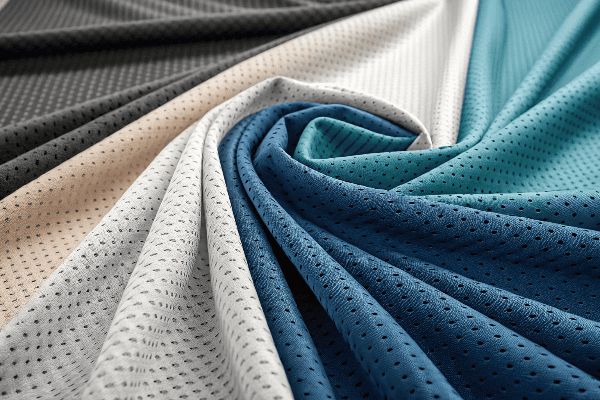 Various sportswear fabrics displayed with different textures and colors
