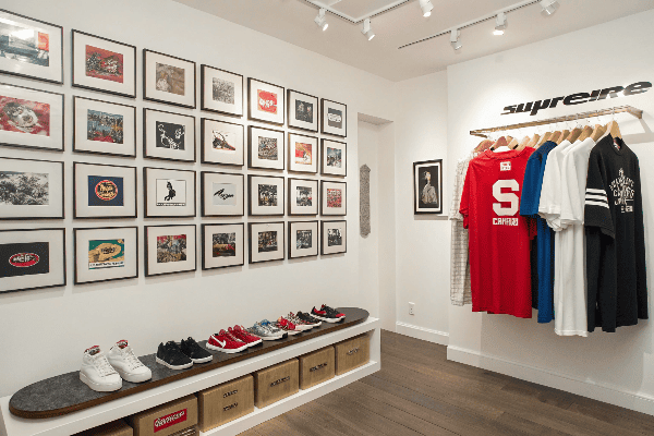 Supreme box logo t-shirt display with skateboarding imagery