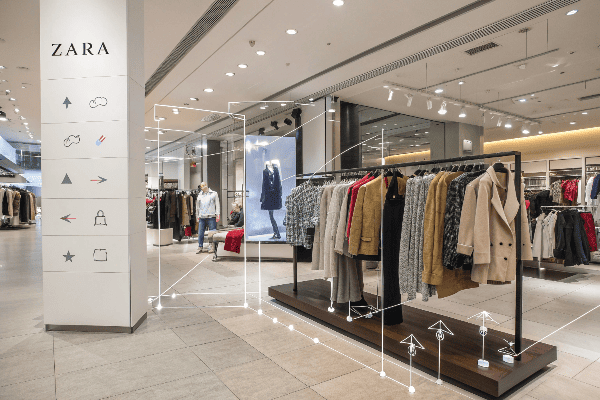 Various Zara clothing lines displayed on retail racks