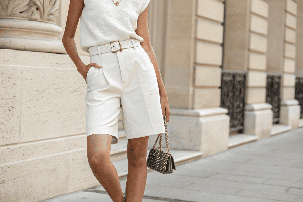 Petite person wearing Bermuda shorts