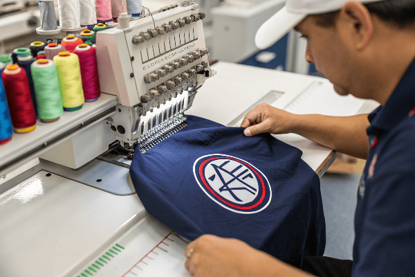 Close-up of embroidered logo on polo shirt