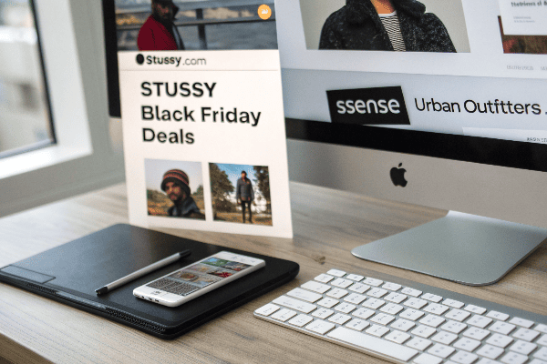 Computer screen showing various websites offering Stussy Black Friday deals
