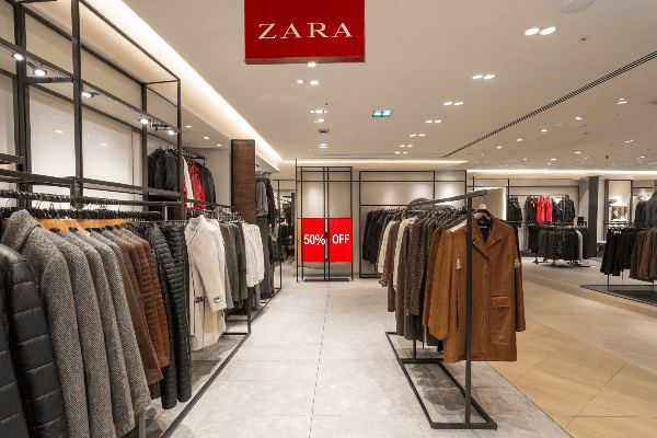 Zara clothing racks with various discounted items