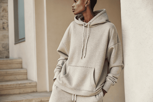 Person wearing Sp5der hoodie showing fit details