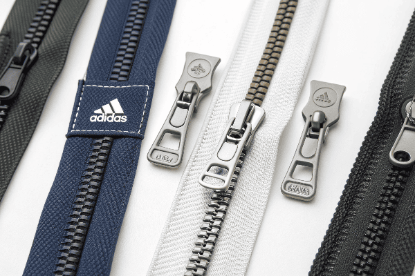 Comparison of different zipper brands used in Adidas products